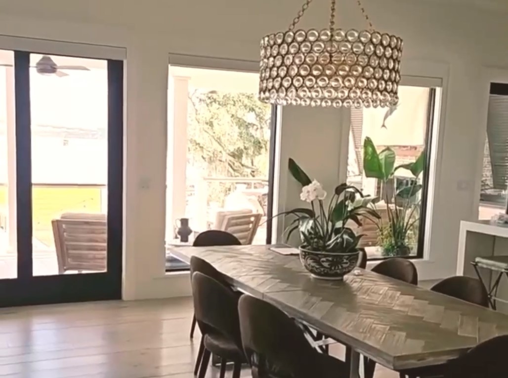 new model home with motorized shades installed and lowering simultaneously on multiple windows